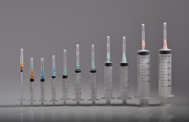 DISPOSABLE SYRINGE